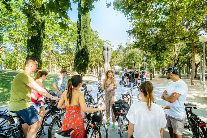 Barcelona E-Bike Small Group Tour with Tapas & Wine Tasting - From Barceloneta to Port Vell: sea air, old harbor vibes, and Columbus views