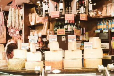 Barcelona: Hidden Markets, Tapas & Paella Food Tour - Born’s specialty stops: cheese, jamón, sweets, and a side surprise