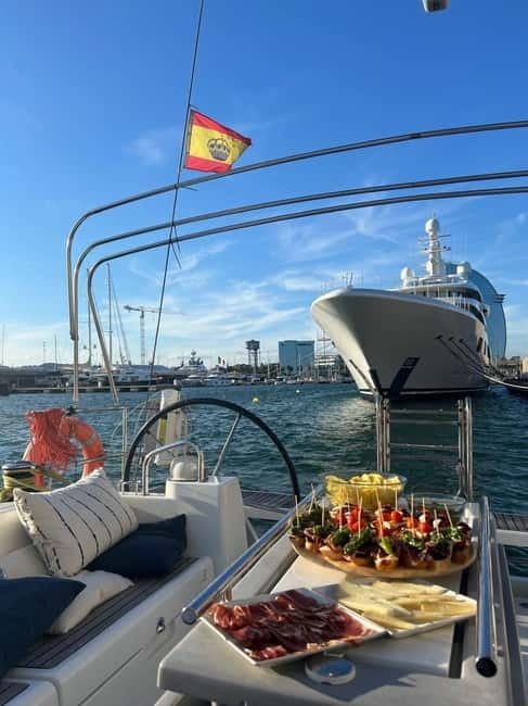 Barcelona: Sailing Tour with Tapas, Drinks and Swim Stop - Tapas and drinks onboard: pinchos, cold cuts, and what’s actually included