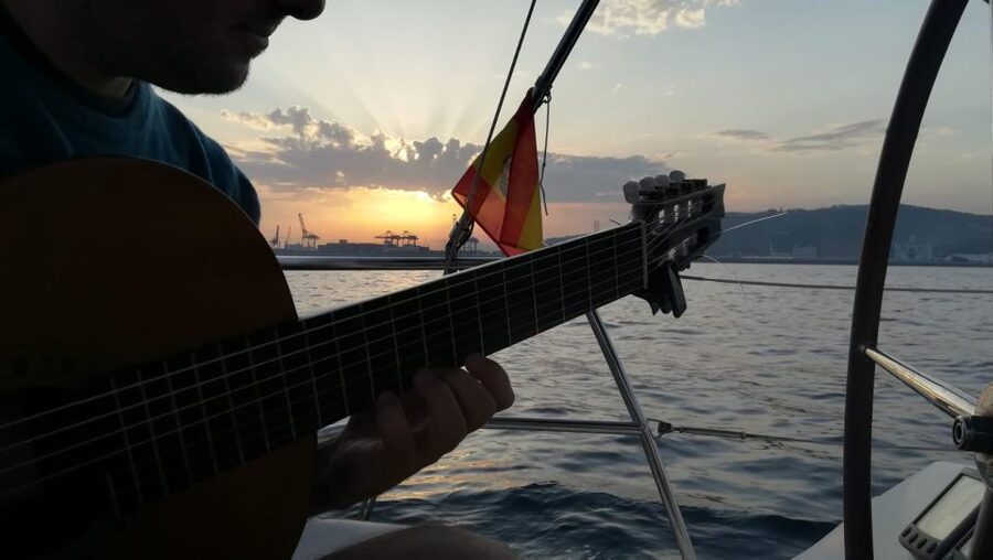 Barcelona: Sunset Sailing with Live Guitar Music and Tapas - Live Spanish guitar on the water: the part that makes it worth paying