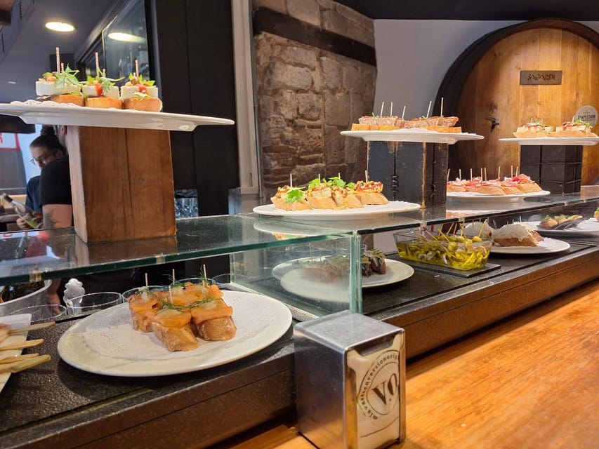 Barcelona: Tapas and Pintxos Tour with Crema Catalana - The Food Lineup: Bravas, Pan con Tomate, Croquetas, and Pintxos