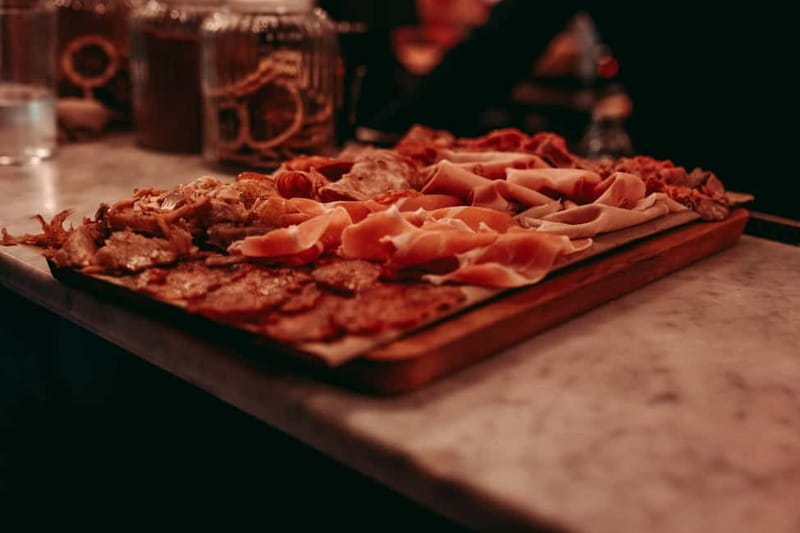 Barcelona: Tipsy Tapas & History Tour in the Gothic Quarter - Mid-tour walking: turning streets and architecture into real stories