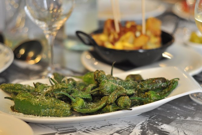 Born to Eat: Gourmet Tapas & Wine Small Group Tour in Old Barcelona - Mercat del Born and the story under your feet
