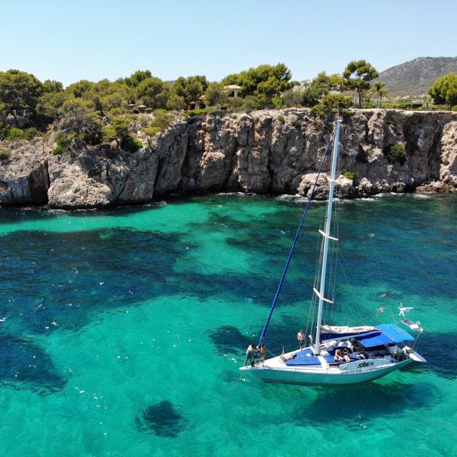 Can Pastilla: Sailboat Tour with Snorkeling, Tapas & Drinks - Stop 1: Cap Enderrocat and your first swim-style break