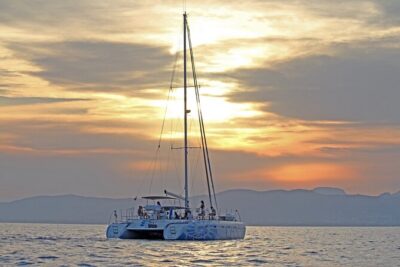 Catamaran sailing at sunset with tapas Palma de Mallorca - Cala Vella cove stop: clear water, swimming time, and how to manage it