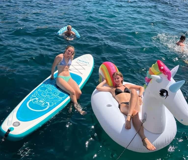 From Palma: Luxury Catamaran Group Tour with Tapas & Drinks - Music, semi-shade, and the vibe on a small boat