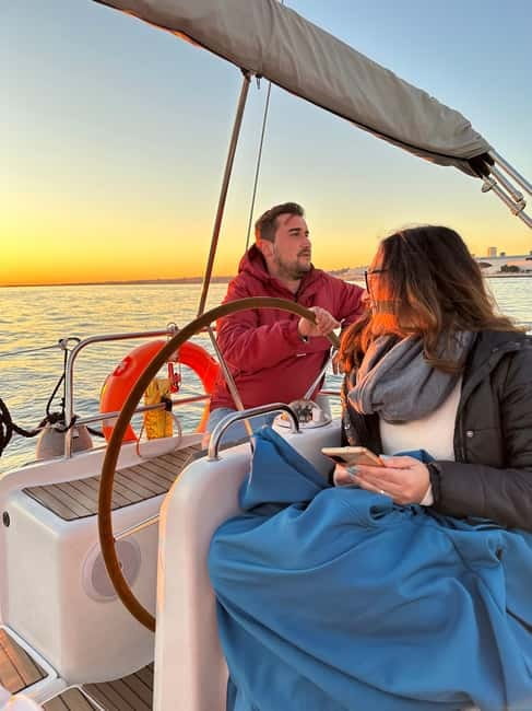 Lisbon: Romantic Cruise with Wine & Portuguese Tapas - The sailing experience: helm time, music, and a little theater
