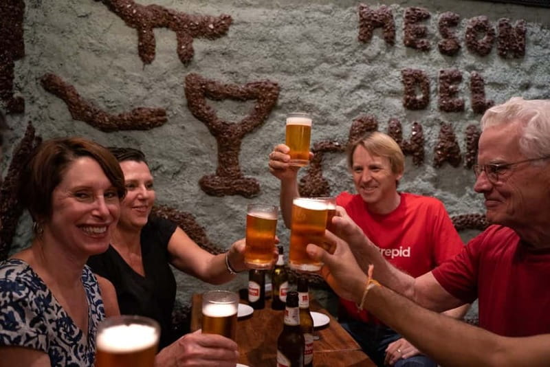 Madrid: Evening Tapas Tour with 5 Delicious Stops & Drinks - Plaza Mayor and the squid sandwich: bocadillo de calamares with beer
