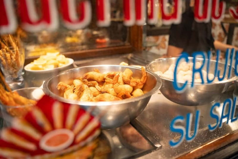 Madrid: Evening Tapas Tour with 5 Delicious Stops & Drinks - The shrimp and Spanish wine stop: how the tour finishes the savory arc