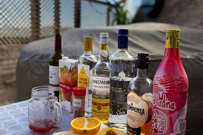 Madrid: Paella & Sangria Classes- Seafood, Chicken & Vegan option - Sangria prep: the drink that sets the pace