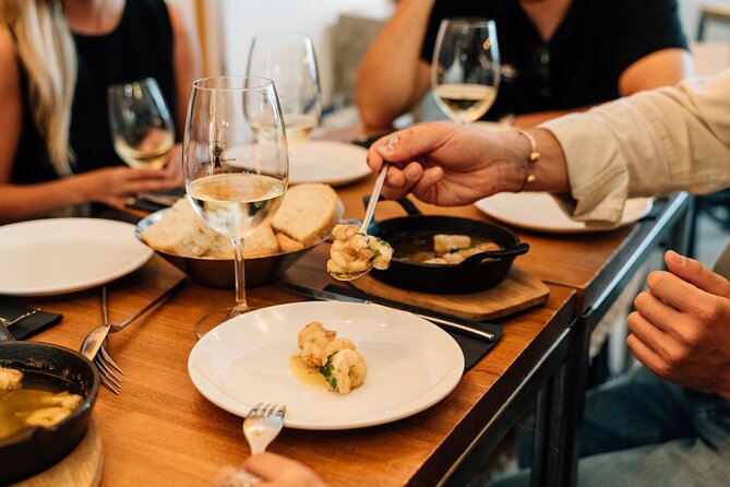 Madrid Tapas & Wine Tour with Rooftop Views and Local Guide - Stop 2: Plaza Mayor cured meats and wine pairings