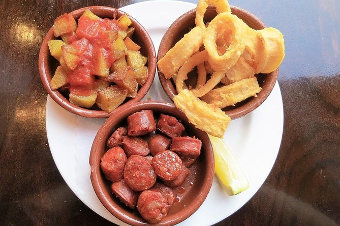 Malaga Market Food Tour: Tapas, Drinks, and Local Flavors - Picasso Area Tapas: Pork Cheeks, Goat Stew, and Onion-Sauced Tuna