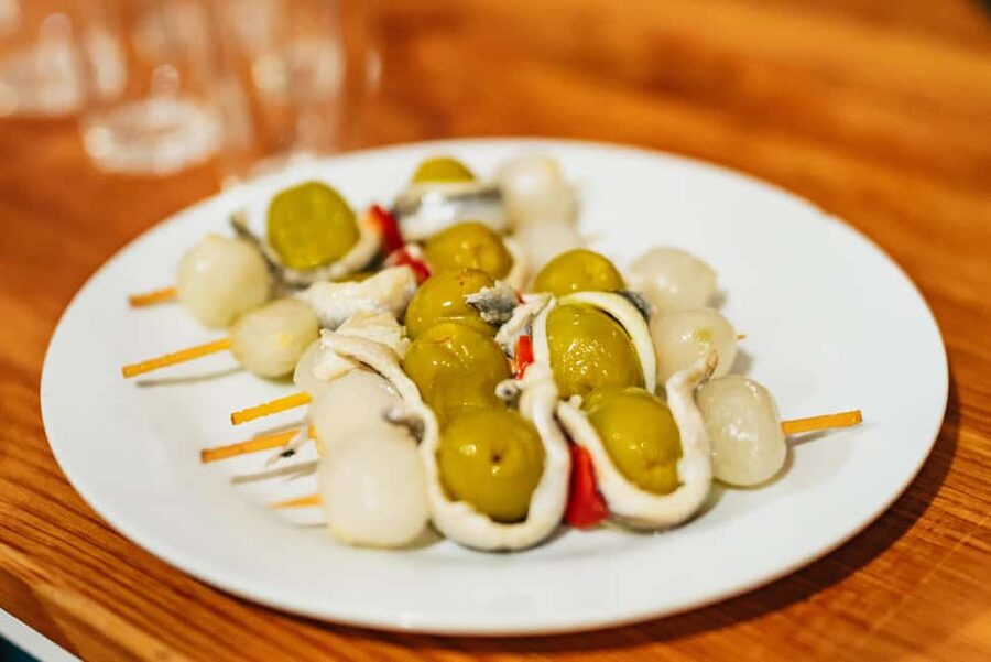 Malaga's tradition and tapas tour with Official Guide - Stop 2: A traditional restaurant with three classic dishes and a drink