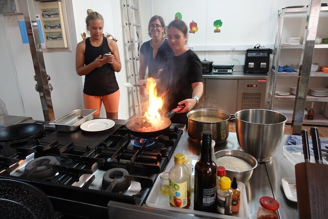 Paella & Sangria Class with Tapas and Market Visit - From stalls to a working kitchen: prep teamwork in a real restaurant