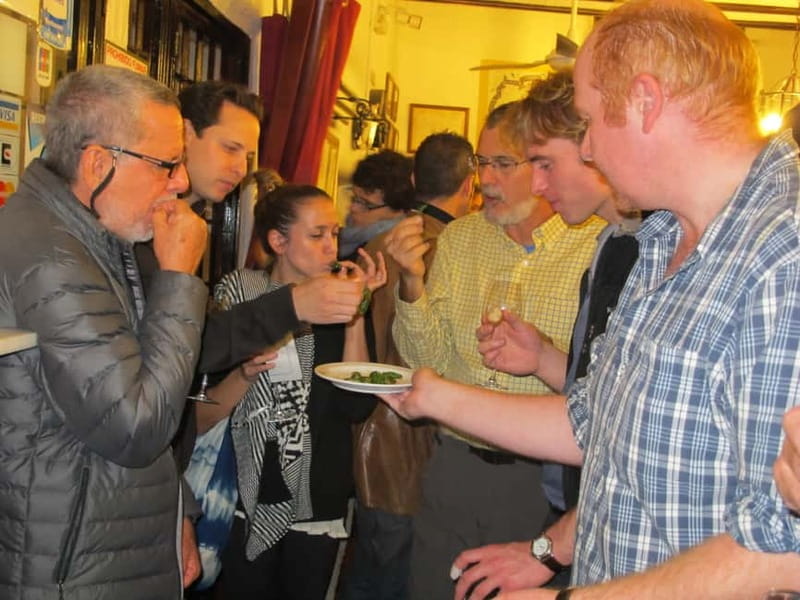 Personalised Traditional Madrid Night Tapas and Drinks Tour - First bar magic: beer or wine plus a guided taste test