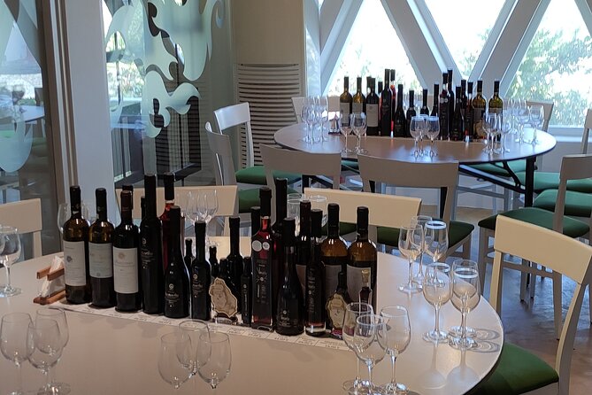 Private Wine Tour in 3 Wineries with 12 Wine Tastings and Tapas - Stop 3: Venetsanos gravity-fed production and caldera cliff views