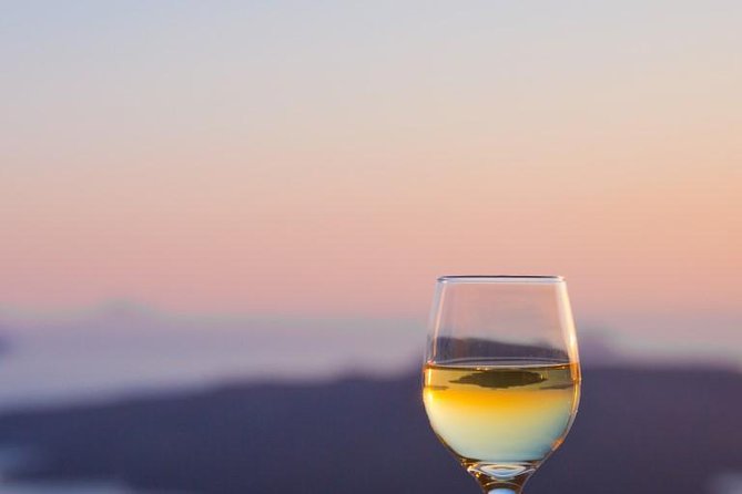 Santorini Wine Adventure with 12 Wine Tastings, Tapas and Sunset - Santo Wines: the always-included stop and the sunset anchor