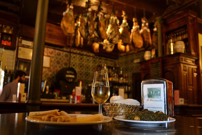 Sevilla Food Tour: Tapas, Wine, History & Traditions - Plaza del Pan: traje de flamenca and a quick cultural sidestep
