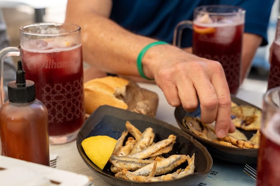 Seville Adventure: Historic Walking Tour & Traditional Tapas - Puerta del Perdón and Alcaicería de la Seda: Islamic Seville in the street-level details