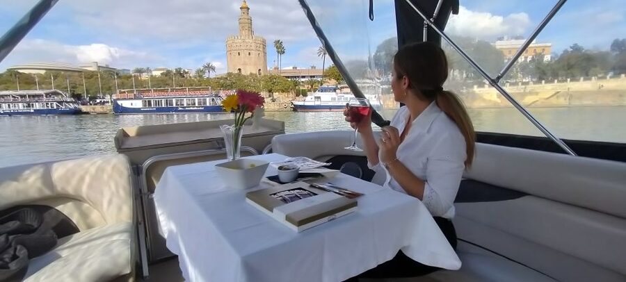 Seville: Exclusive River Boat Tour with Tapas - Comfort on board: music, WiFi, and blankets for real weather
