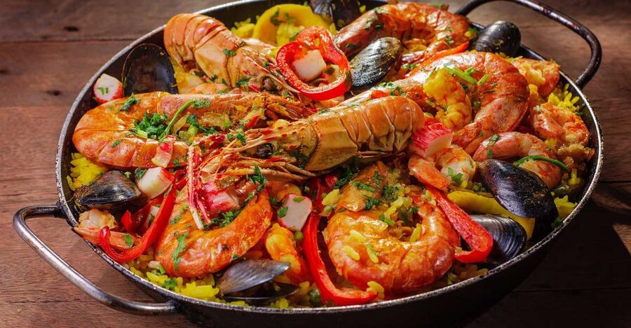 Tapas Tour Paella and Malaga market with Official Guide - The First Stop at the Old Tavern: Wine, Snacks, and Bay Anchovies