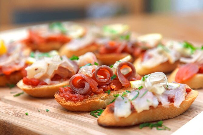 Tasty Tapas & Drinks Tour with a Rooftop Included - Meeting at Taberna Tirso de Molina and Finishing at Plaza de España