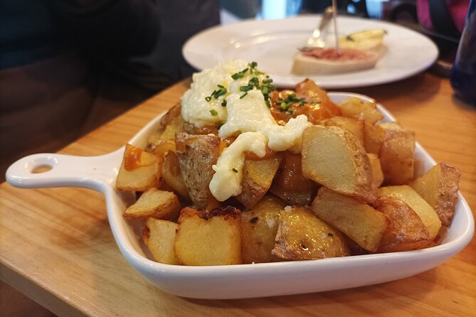 Valencia Food Tour: Tapas, Drinks and Delights with a Local - Stop 2: Plaça del Tossal—Arabic influences and tapas comfort food