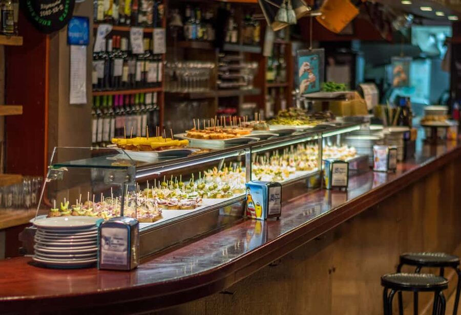 Valencia: Mysteries, Legends, & Local Tapas Experience - Plaza Redonda tapas stop: circular square, market past, and included bites