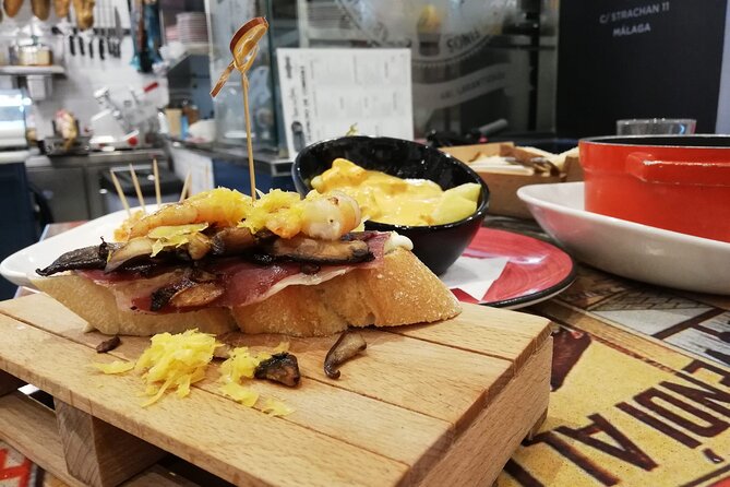 Wine and Tapas walking Tour in Malaga - Stop 1: First Tapas at a Classic Malagueno Bar